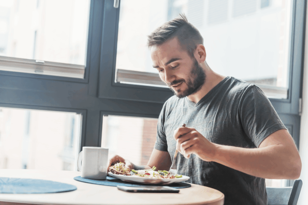 man eating healthy food to improve fertility